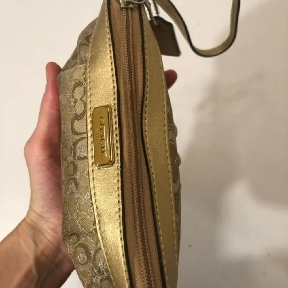 Coach gold optic wristlet